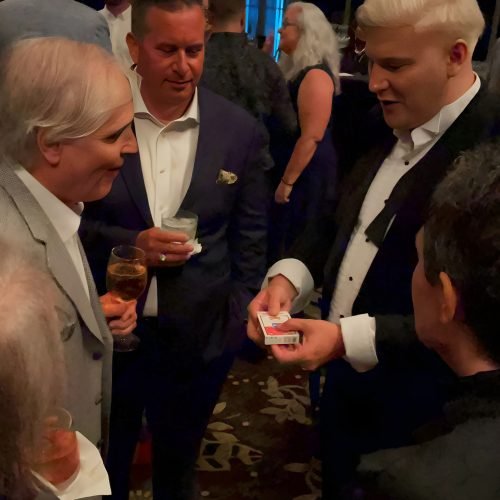 close up magician miami david frost entertaining guests